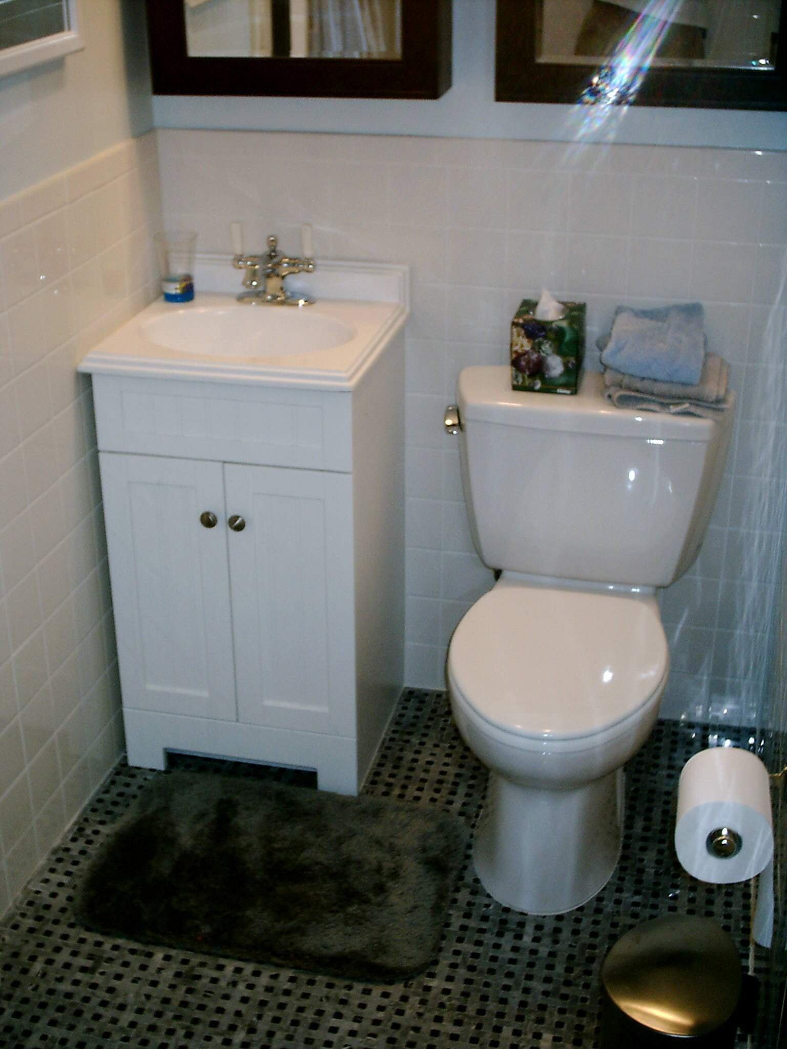 Bathroom remodeling with new vanity and toilet installation.